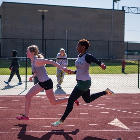 Claire Ash and Torian Busby place second 4x100 relay.