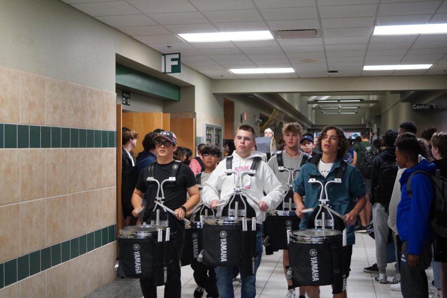 Santa Fe Drumline led the Wolves Cross Country team through the halls.