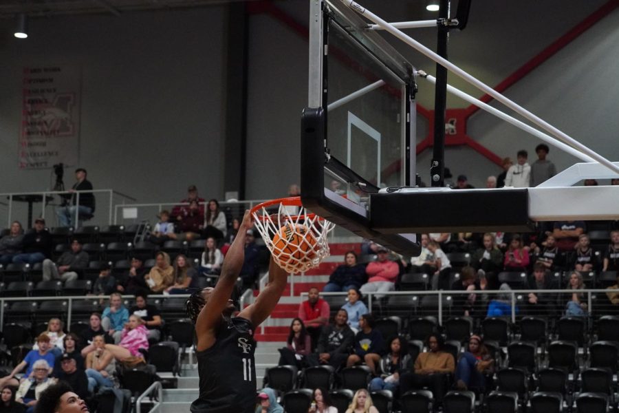 Tristian peters dunking the ball. He had 14 points off the bench.