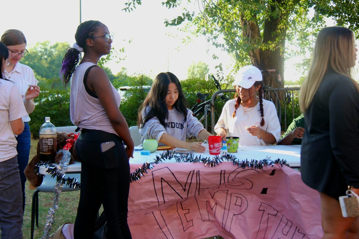 Seniors working the NHS booth at HOCO fest.