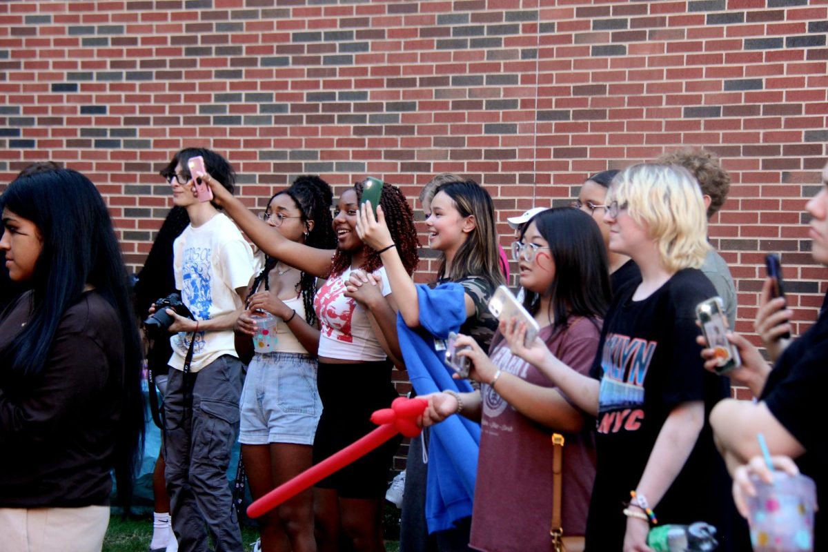 Students sang and videoed performances during HOCO fest. 