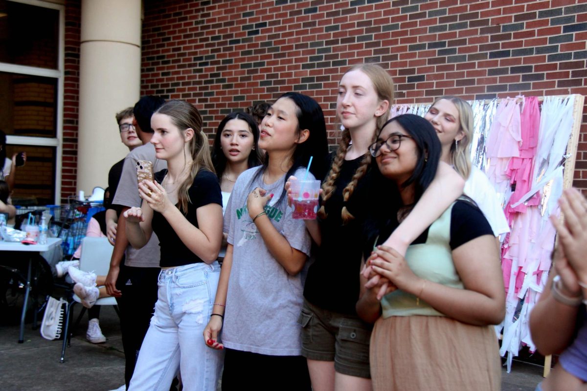 Students listen to performers at HOCO fest. 