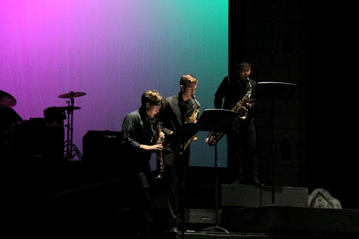 Senior Preston Thorpe and bandmates play a song on the saxophone. 