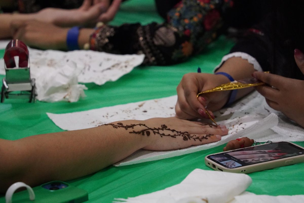 People getting henna in India. 