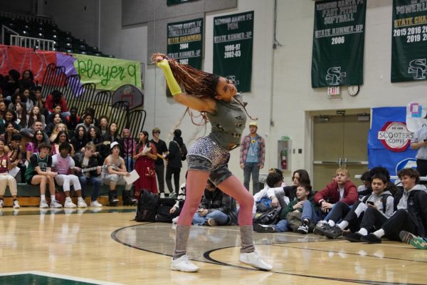 Kiana Stewart whipping her hair back and forth during Santa Fes Got Talent.