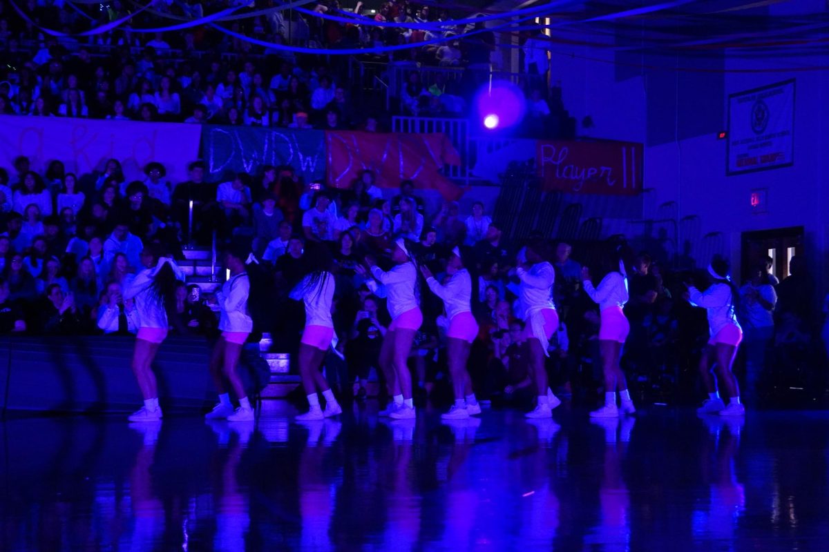 Stomp team stomping on to the court for their Blacklight performance. 