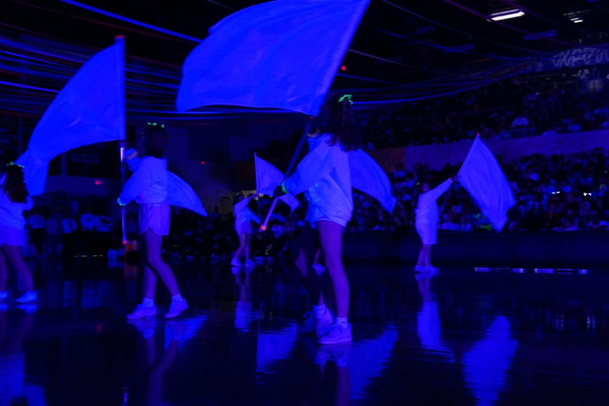 Color Guard waving their flags during their performance at Blacklight. 