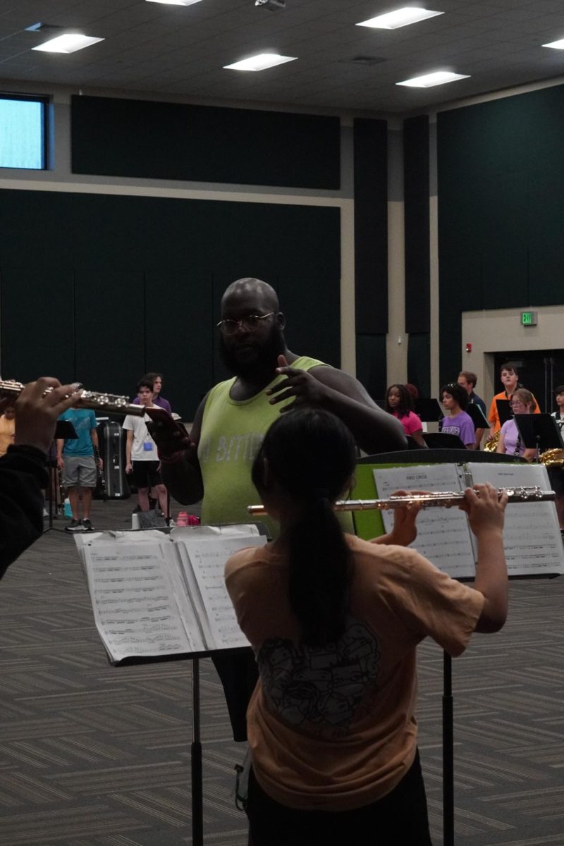 Band Associate Director Milik Coffer working on harmonizing the flutes and teaching the woodwinds harmony. 