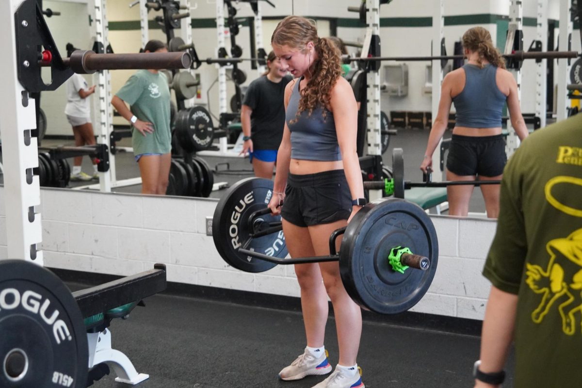 Maddy Mcmillin, junior, performs a deadlift at morning workouts. 
