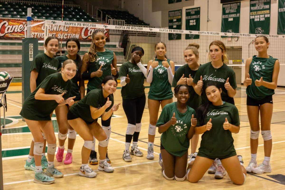 Santa Fe's freshman volleyball team poses for a picture following their morning practice. 