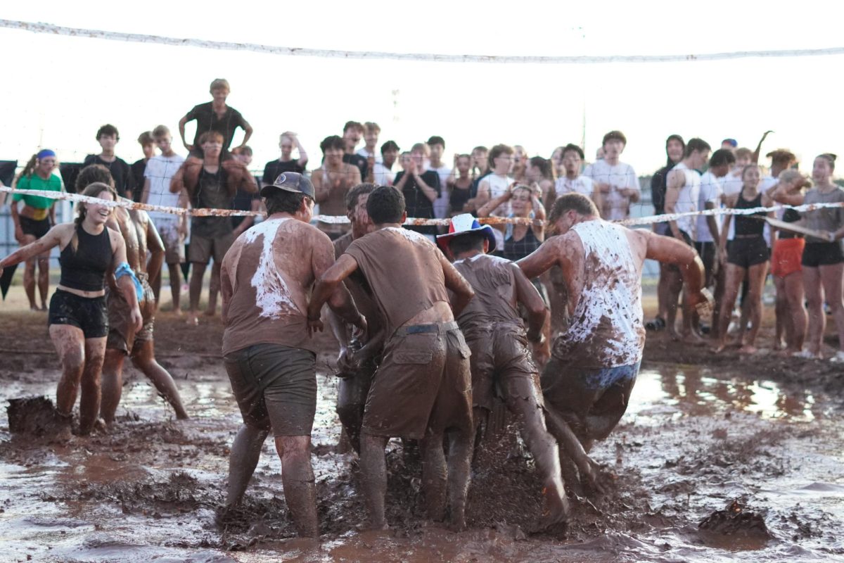 STUCO bros mud Volleyball team celebrating a point.