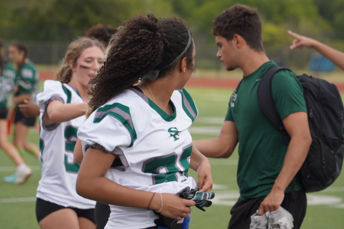 Mia Barnett looking around at teammates after the junior's defeat. 