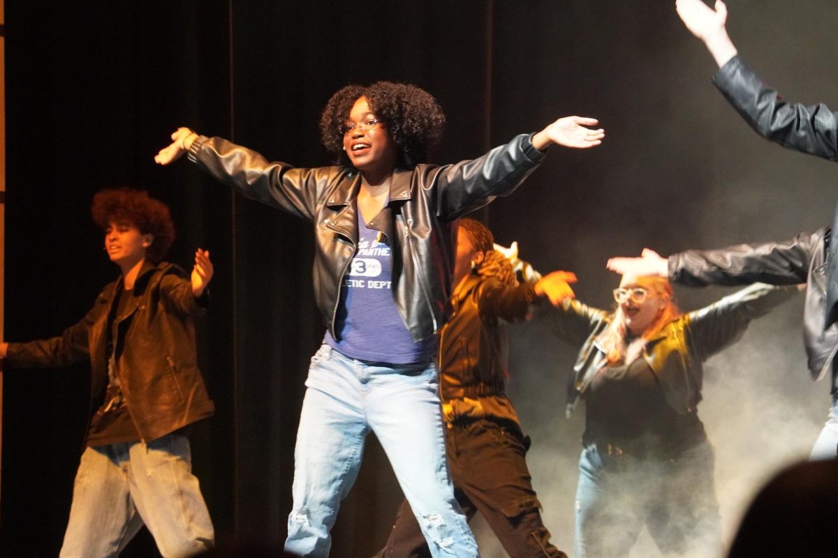 Emorie Hayes dancing during the show choir's performance.