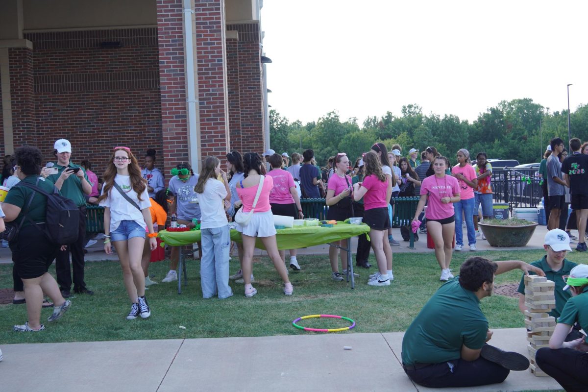 Students playing games at the Fine Arts tailgate.