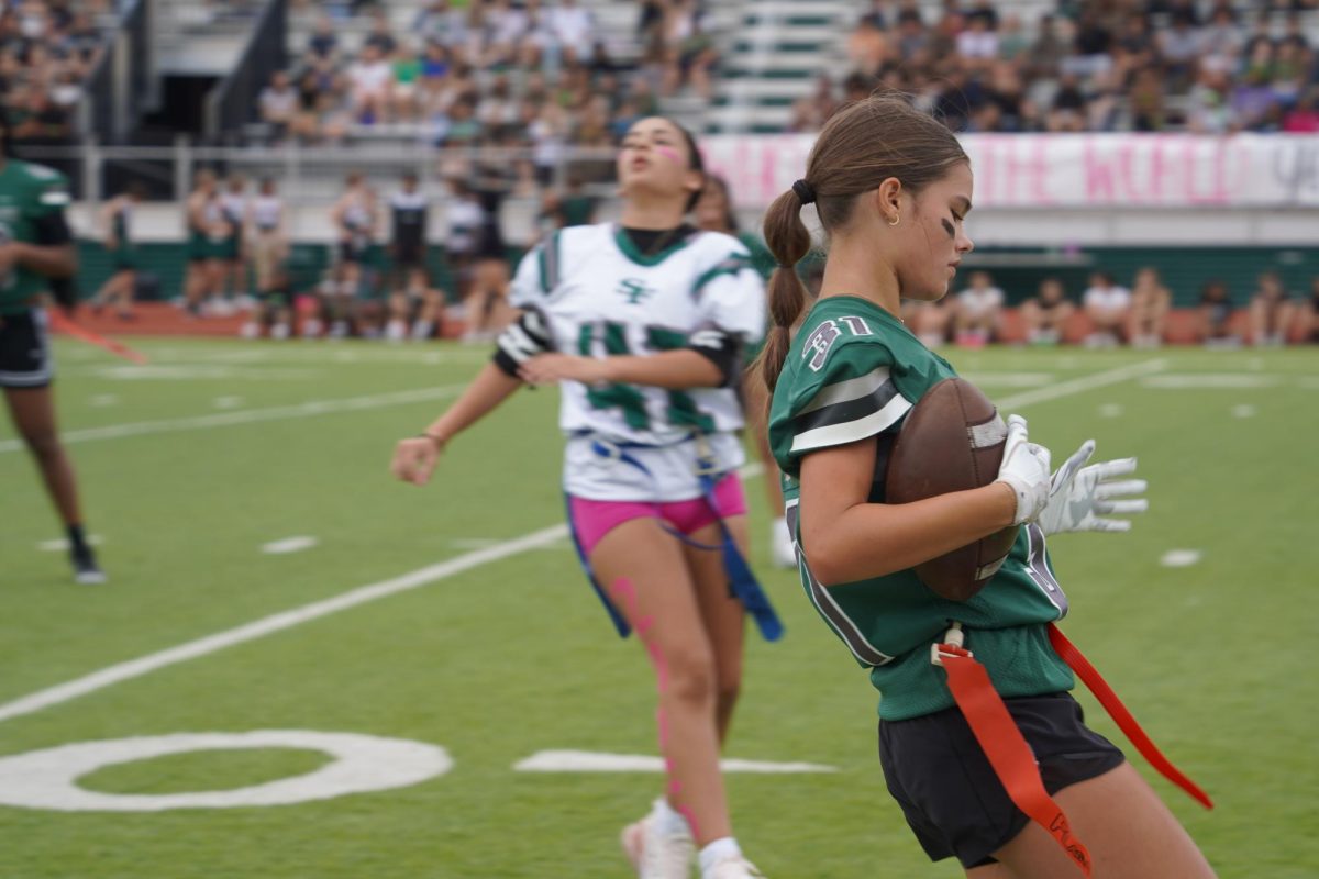 Student on the freshmen team after catching the ball. 