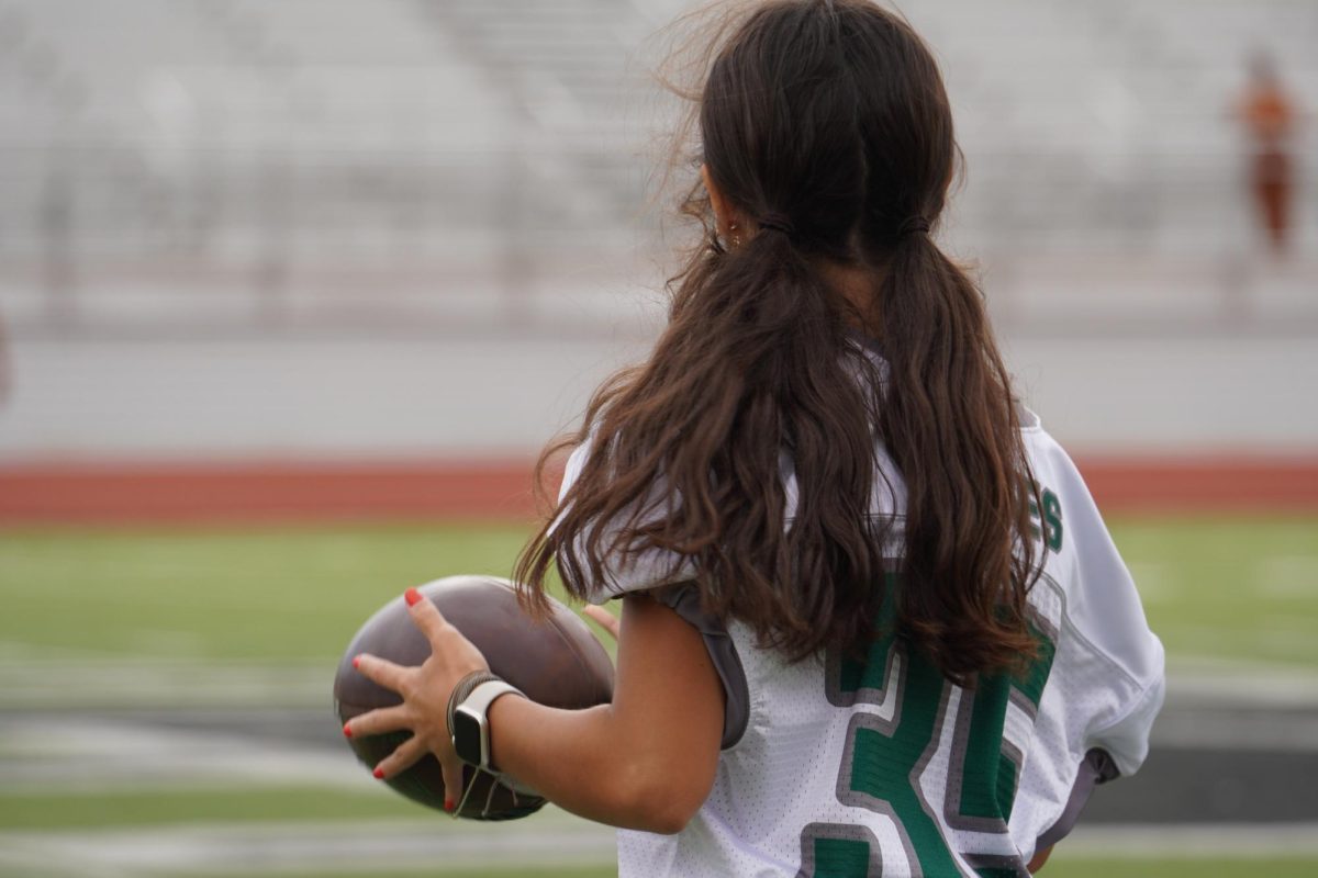 Madi Battiest looks off into the field after she caught the ball from one of her teammates. 