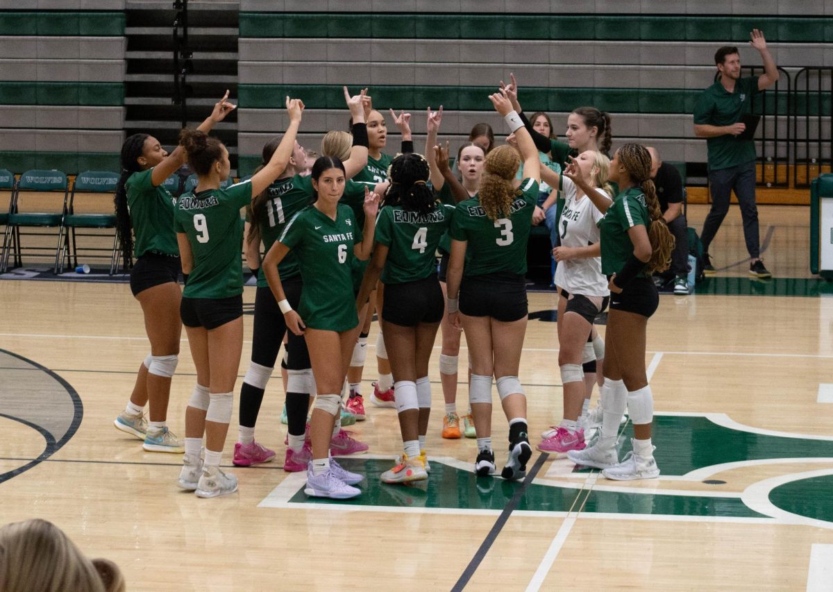 Santa Fe Varsity volleyball team celebrating.