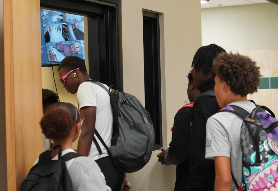 Students waiting to receive their tardy slips after lunch. 