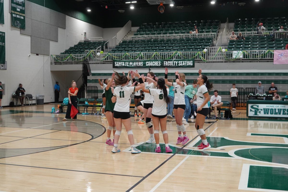 Varsity celebrating an ace in the game.