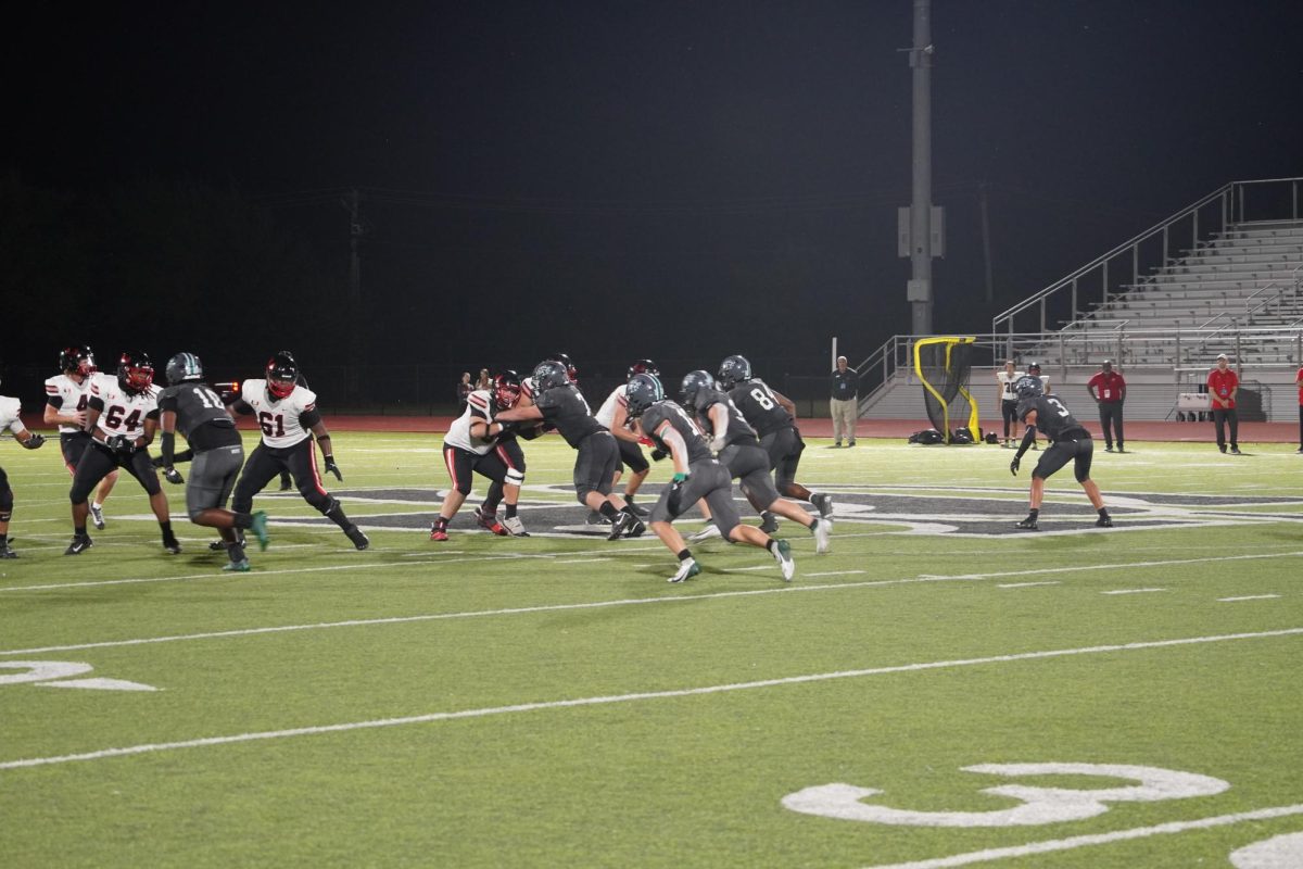 Santa Fe football team playing union at Hoco game.