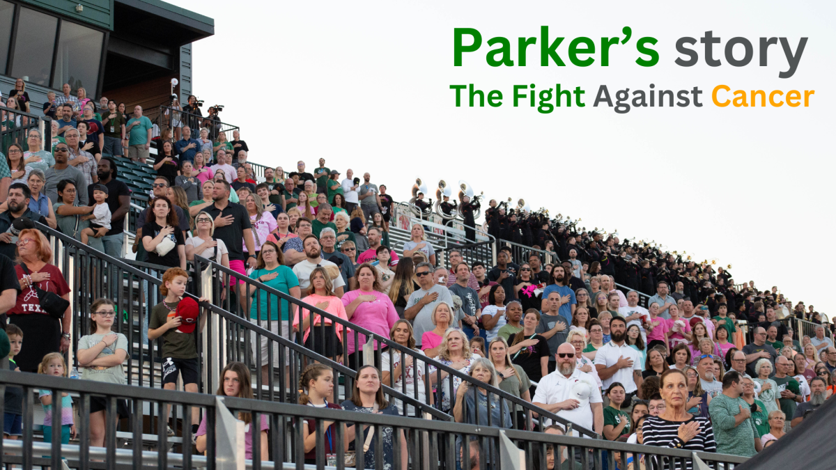 Families of Santa Fe students stand for the Pledge of Allegiance at the football game, where proceeds went toward Parker’s treatment costs.