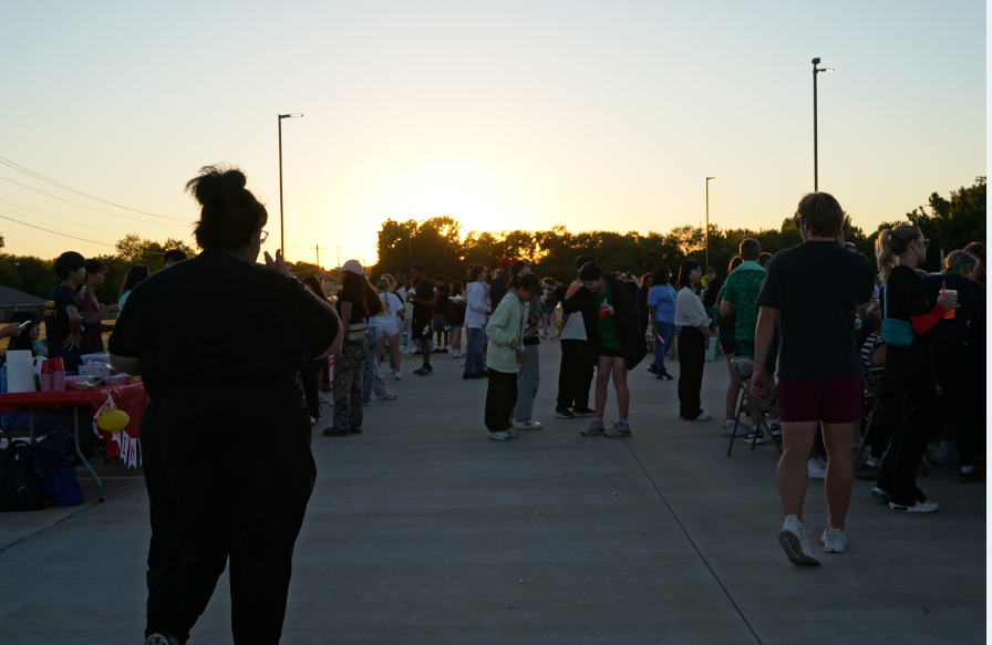 Students walk around the various booths at HOCO Fest