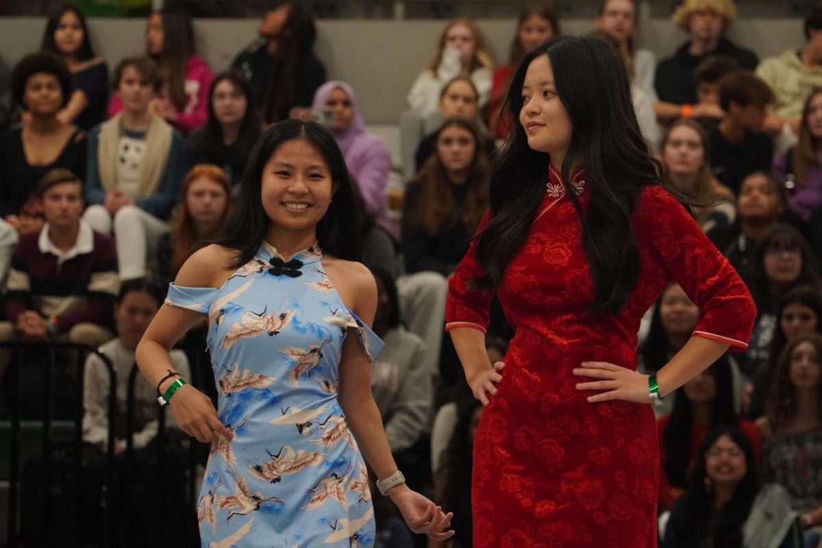 Senior Erica Lin and junior Emme Shum representing China in the fashion show.