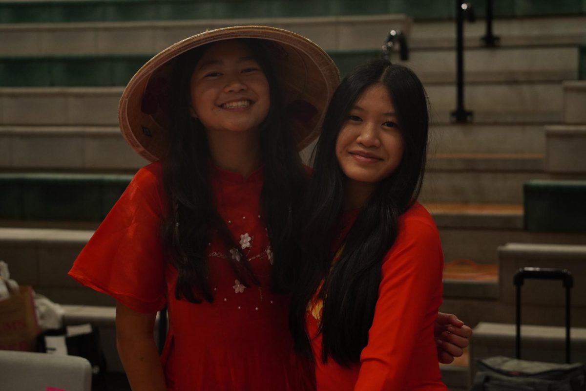 Sophomore Claire Varanusupakul and junior Karla Le running the Vietnamese booth.