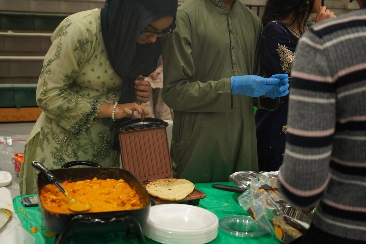 Students preparing food at the Pakistan booth.