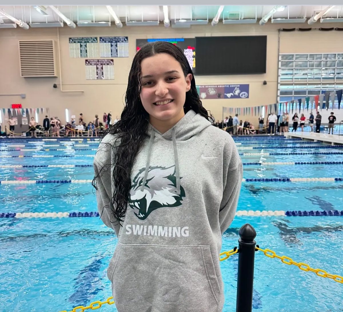 Sophomore Dyanelis Hernandez Silva poses for a picture after beating the 100 breaststroke record.