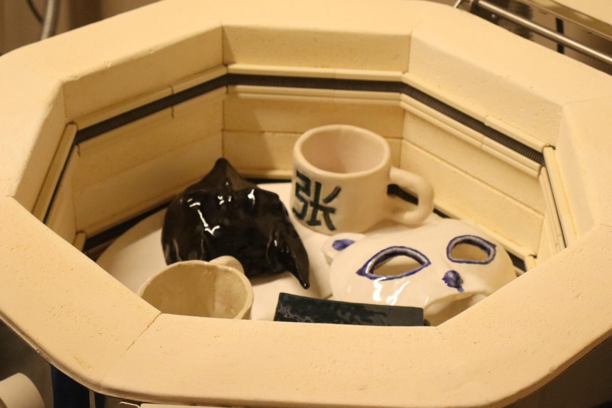 Student-made projects inside of the ceramics kiln.