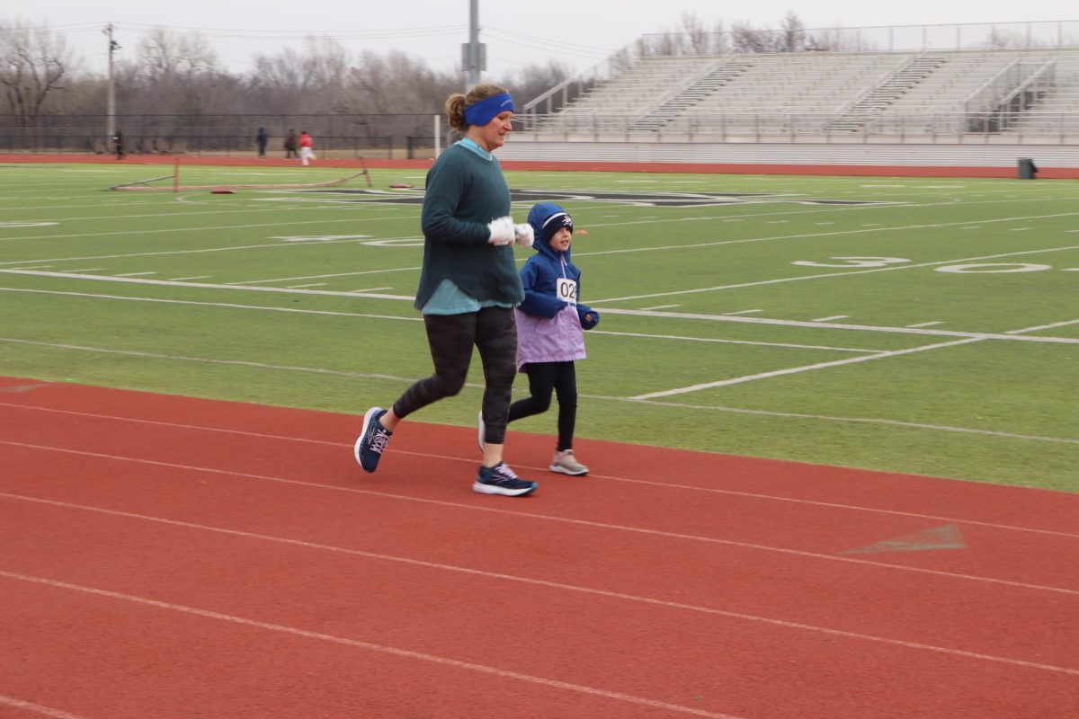 A mother-daughter duo running fun run.