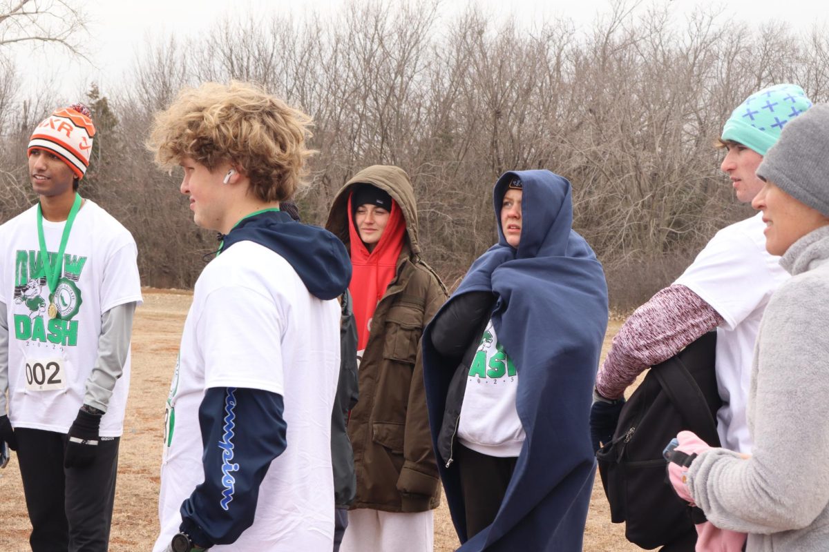 Runners staying warm between the fun run and 5K.