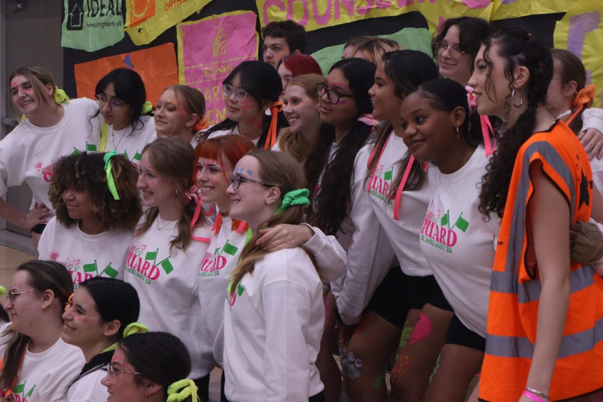 Color guard posing for a group photo before their performance.