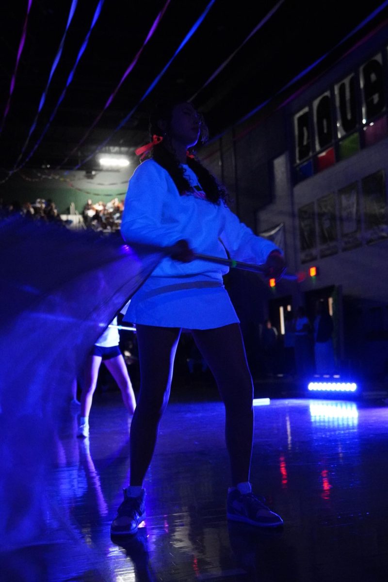 Junior Shian Fletcher performing for color guard.