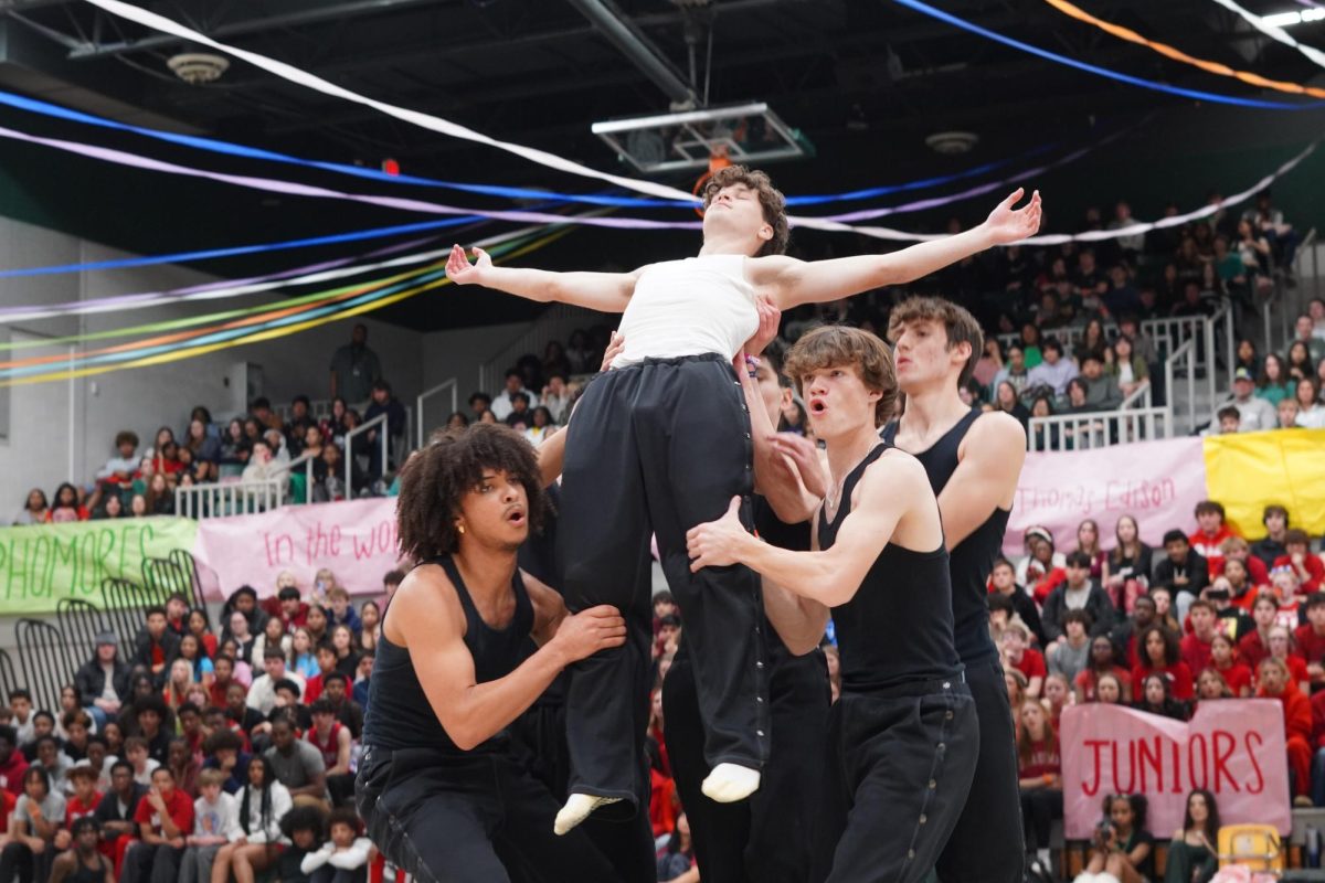 Senior boybands group performing a stunt. 