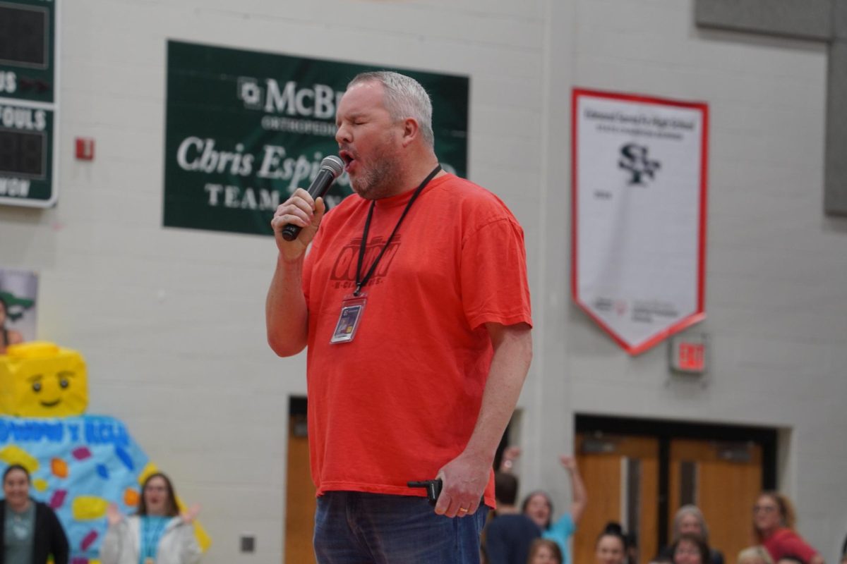 Principal Mr. Hayes howling at the final assembly.