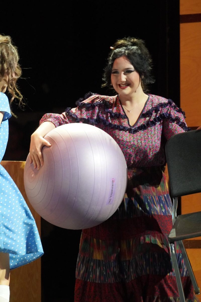 Junior Shelby Gomes, as librarian Mrs. Phelps, excitedly awaiting Matilda's story.
