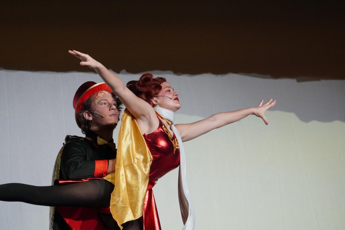 Sophomore Ben Terrell, as the escapologist, and freshman Estella Rambo, as the acrobat, acting out Matilda's story.