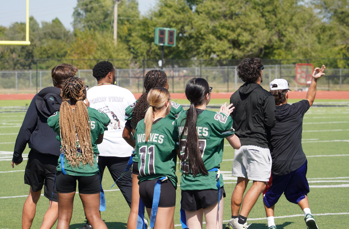 Powderpuff girls and their coaches celebrating.
