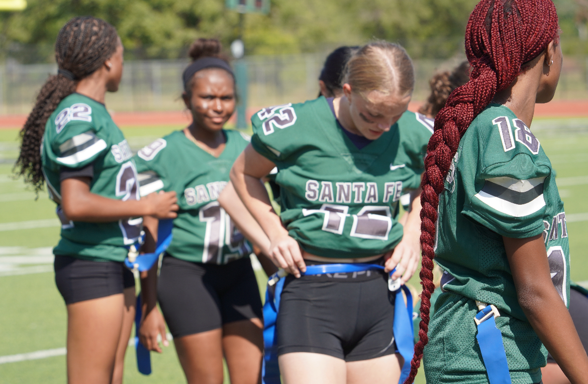 Senior Kaitlyn Fulkerson adjusting her jersey.