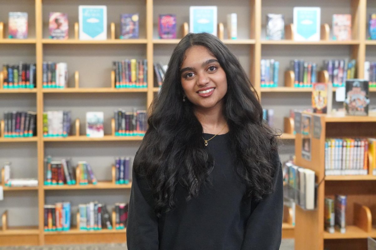 Ilakiya Raghavendiran posing in the Santa Fe library.