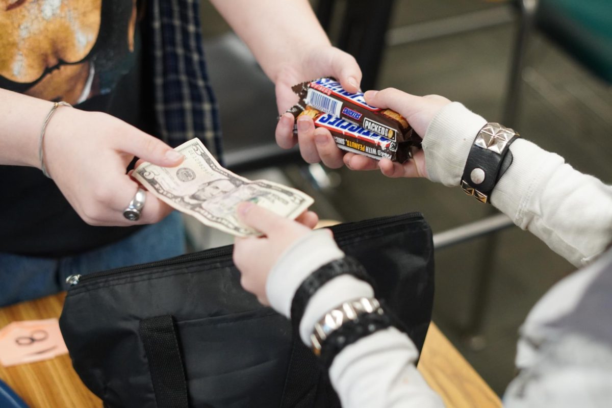 A transaction made by a royalty member and customer for candy.