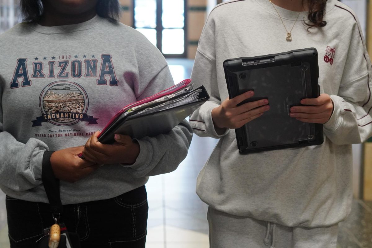High school students holding supplies in Freshman Academy. 
