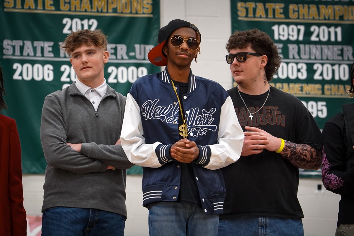 Seniors Kash Van Cleave and Taylor Resnick and sophomore John Livingston participating in hall of fame.