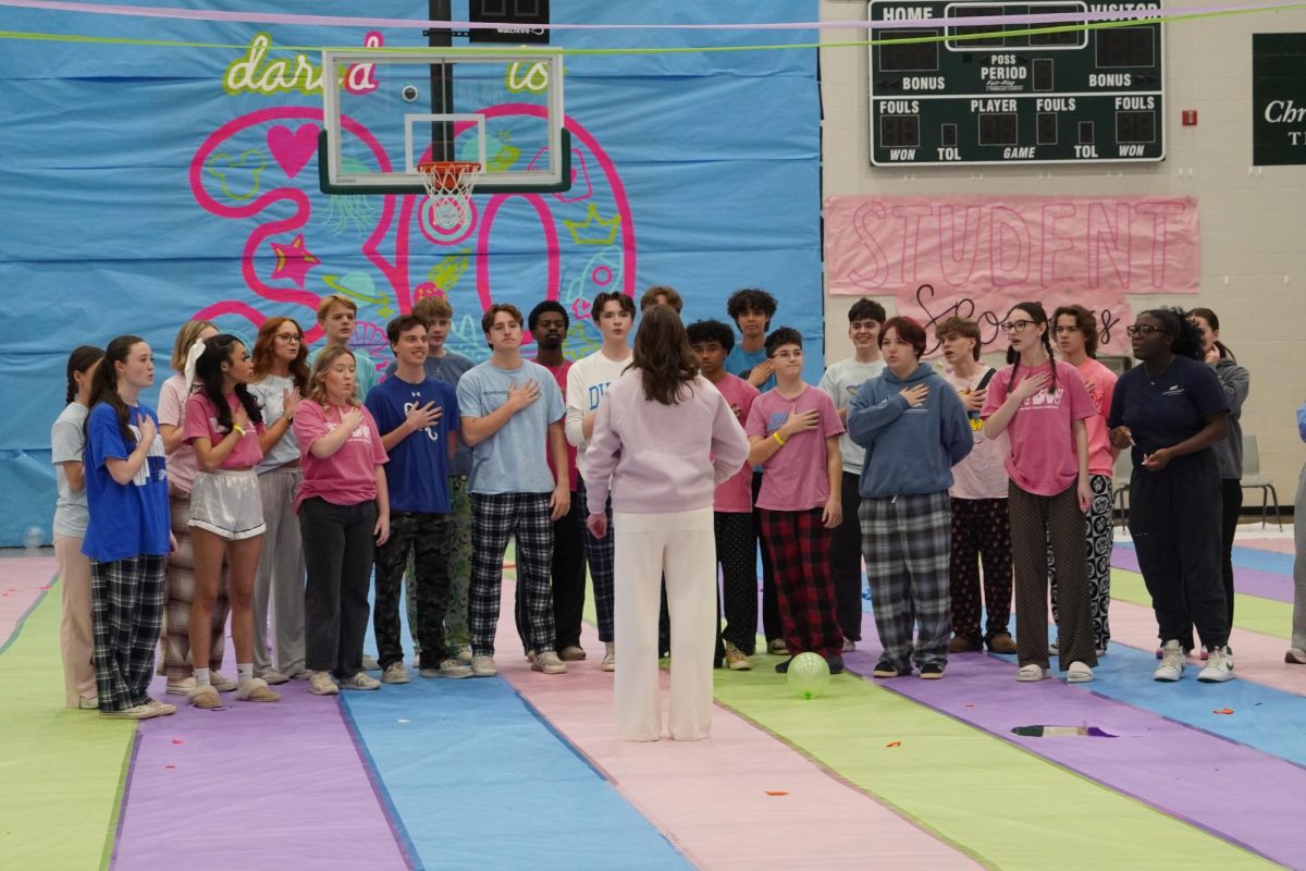 Both of Santa Fe show choirs singing the National Anthem.