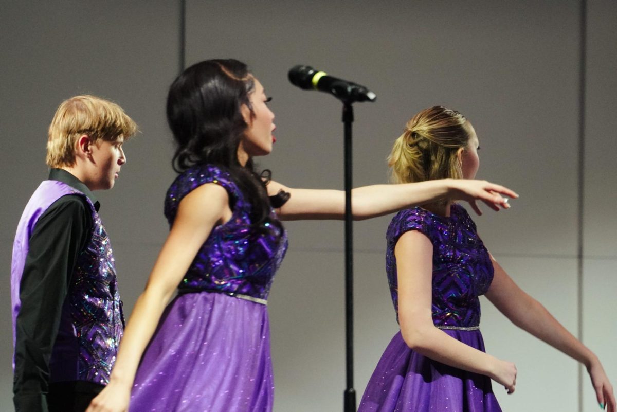 (Left to right) Junior Landon Hoffman, senior Sha'Rya Walker and Genevieve Young dancing to "Electricity."