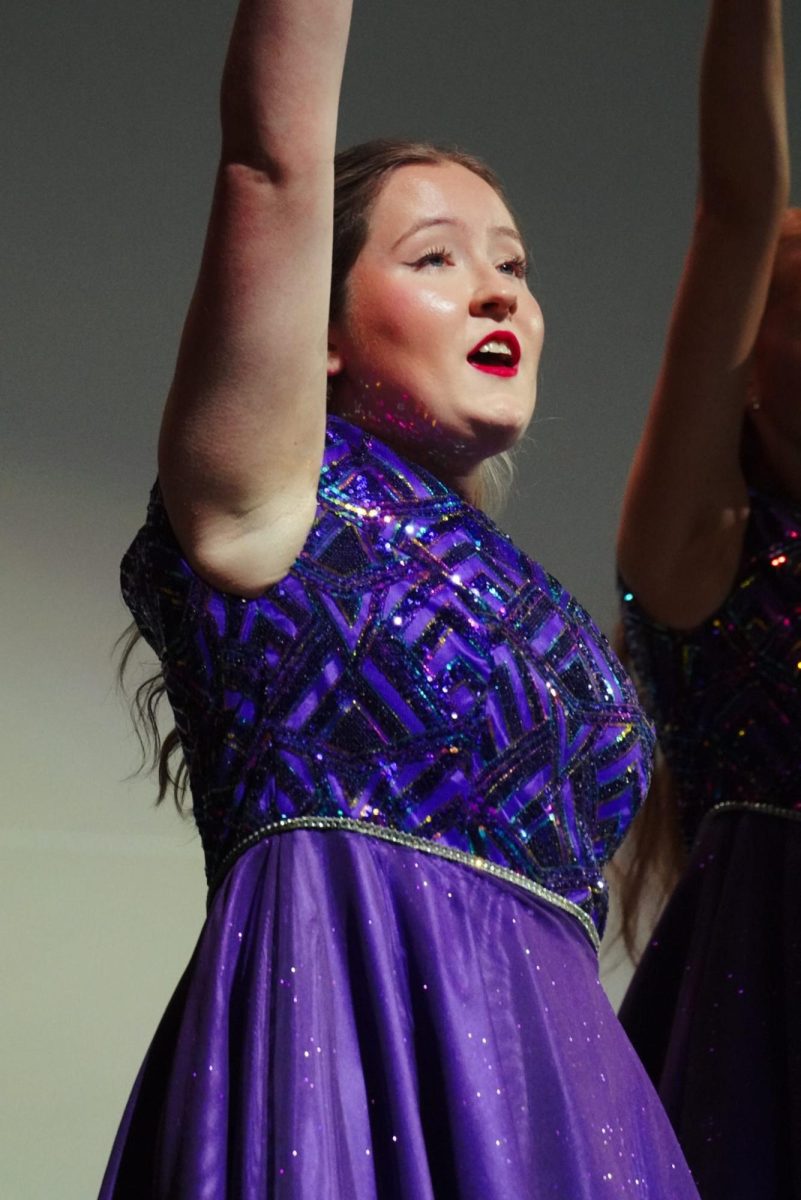 Senior Alexa Hoggatt singing "Electricity." 