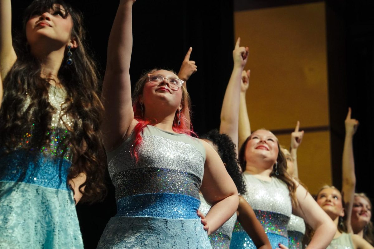 (Left to right) Senior Averie Knapp, freshman Carmen Hudson and sophomores Hallee Hoggatt, Keilie Milam and Caroline Brooke posing at the end of their final song "Long Live."
