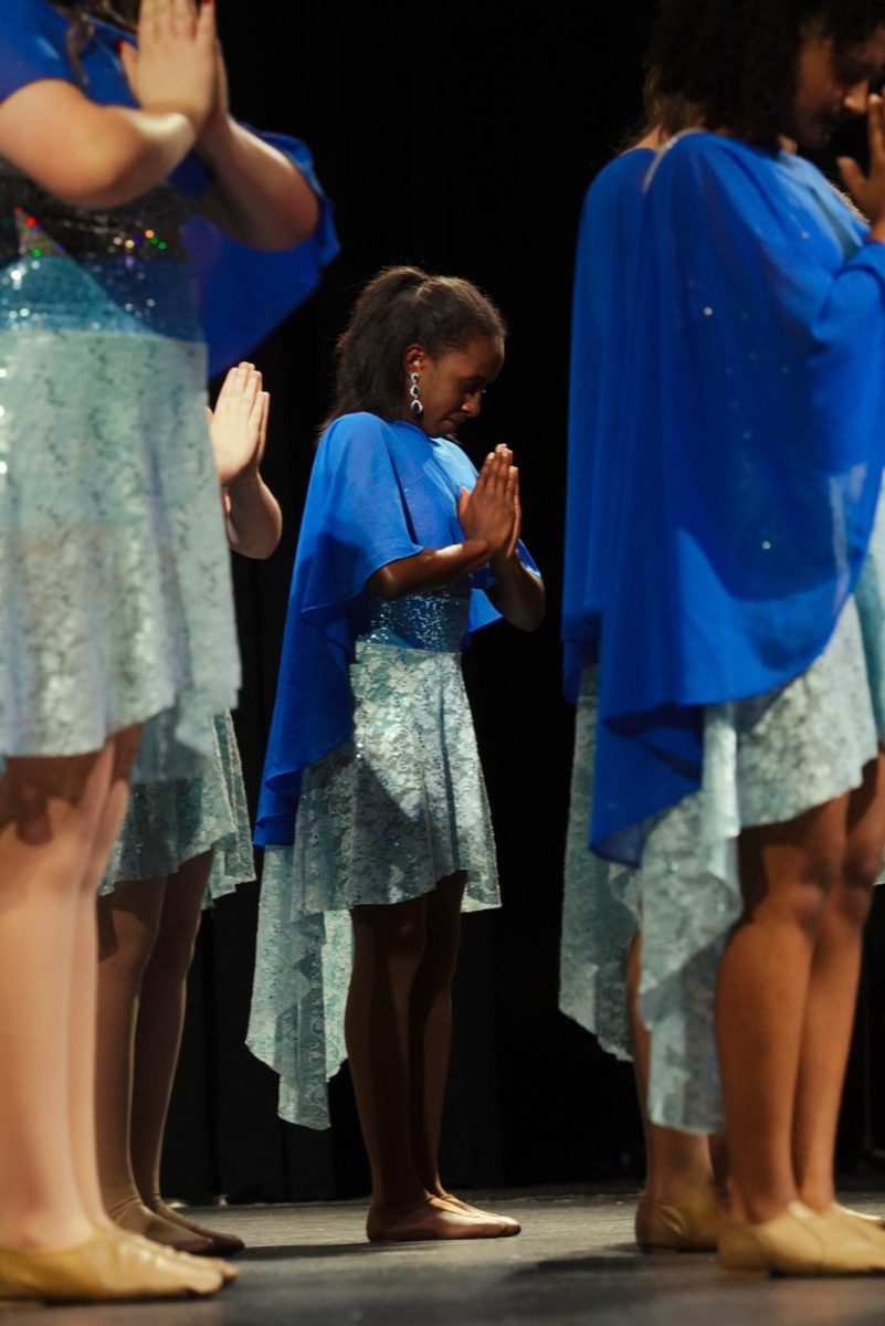 Sophomore Tristan Wilson and other Serenade members posing at the end of "Spirits."